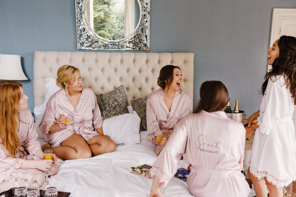 Bridesmaids in pink gowns in bridal suite at Chateau Soulac
