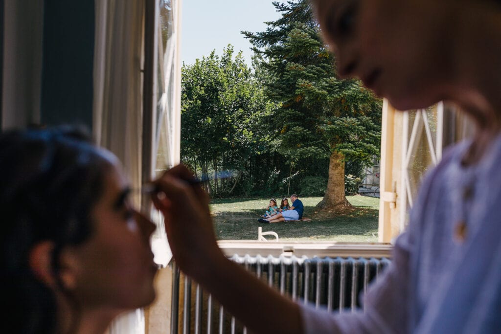 Bride makeup at Chateau Soulac - family in background